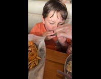 Kid tries oyster and spits it out