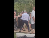 Older group of people dancing getting low