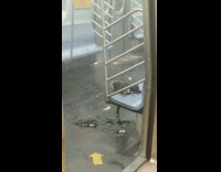 Remnants of burnt unknown objects still smoking in the subway train 
