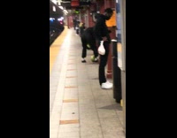 Black pants guy two watermelons subway station 