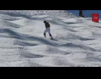 Skier skis down slope in race competition, hits bumps and rolls down hill