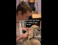 Filmer laughs at man that uses typewriter