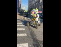 Buzz Lightyear mascot do donuts with ATV