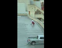Woman in a pirate costume with camera on skateboard