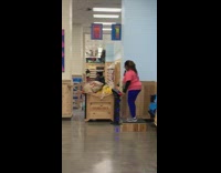 Woman pink shirt sings karaoke at Trader joes grocery store