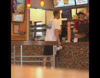 Guy yells into speaker megaphone when he orders popeyes chicken sandwich