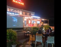 Projector plays Daily Dose outside the restaurant