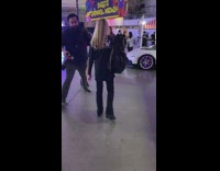 Black skirt red shirt white car carnival