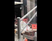 Construction guy take huge plastic wrapper windy