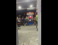 Group of rollerbladers meetup at gas station 