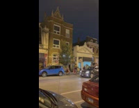 Man and Woman in Mexican outfit dances at the side of the street