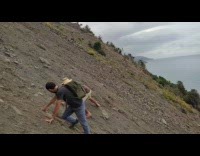 Two men stuck on the steep hill after the landslide