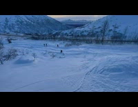 Person Trips on Snow Slope with Ski