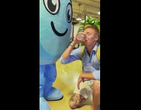 Guy drinks from in between characters legs 