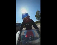 Motorcycle rider dance macarena at the intersection