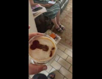 Woman hands mother coffee with penis drawn in foam