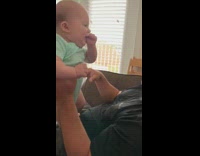 Dad swings baby around laughs