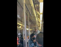 Grey sweater guy black portable speaker sings