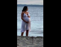 Woman white dress pregnant photo shoot beach