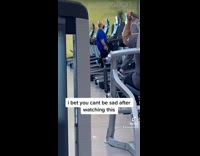 Happy guy walks dances on treadmill