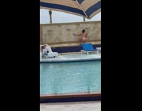 Blonde lady twerks at poolside 