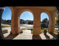 Car drive on neighborhood sidewalk security footage