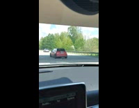 Kermit drive red car on the expressway