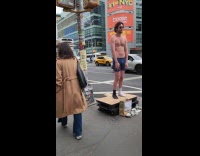 Man stands on street for engagement fund