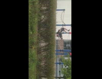 Guy flips over in playground net, does scorpion 