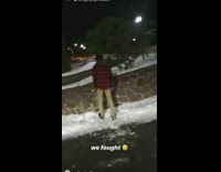 Guy punches small snowman 