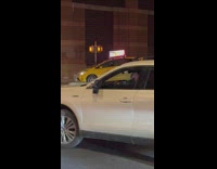 Taxi driver accidentally gets stuck on divide
