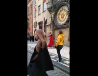 woman long red dress old clock