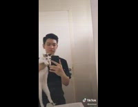 Guy white cat switch heads bathroom mirror 