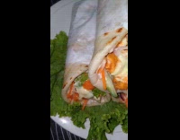 Homemade shawarma wrap wraps on white plate