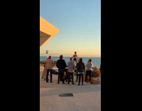 Male dancer jumps into splits on trampoline 