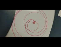Red circular lines white board hypnotic spin