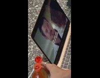 Woman eats food watches show on subway train