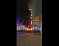 Giant christmas engulfed in fire and smoke