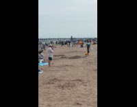 Woman twerking on lifeguards chair 