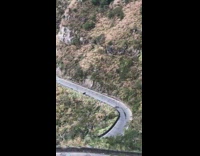 Winding mountain road view windy cars day 