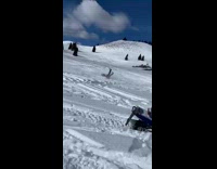 Guy attempts wheelie on snowmobile but fails