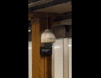 Subway security camera hang low and swings