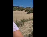 Woman in bikini beach grass video shoot