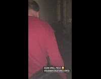 Evacuated subway passengers walk through tunnel