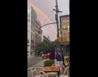 A full half circle rainbow over building nyc