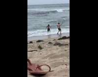 Shirtless guy stands in water for music video filming 
