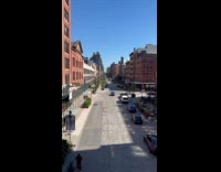 Man sing with microphone on street beside bike