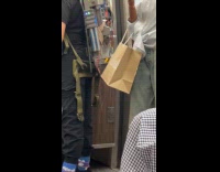 Woman carrying strange backpack machine