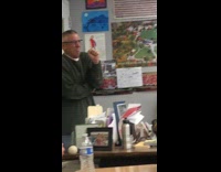 Guy offers teacher banana 