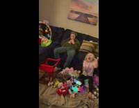 Kid in headphones gets hit by a marshmallow ball